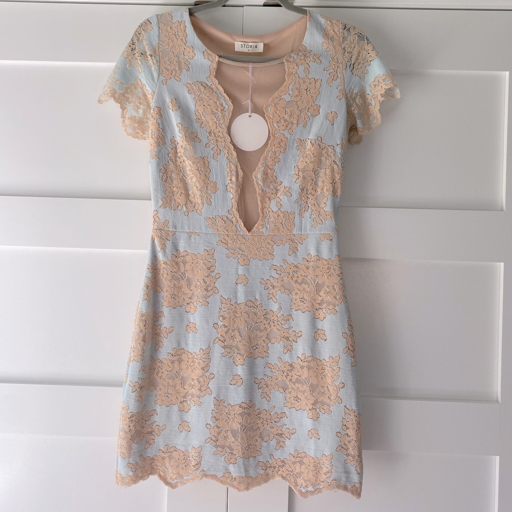 Pale blue and pale peach color dress. New with tag, never worn!